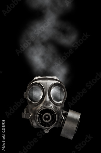 Photo: Gas mask with smoky background Gas mask with smoky background