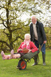 Photo: Senior Couple Man Giving Woman Ride In Wheelbarrow Senior Couple Man Giving Woman Ride In Wheelbarrow