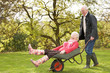 Photo: Senior Couple Man Giving Woman Ride In Wheelbarrow Senior Couple Man Giving Woman Ride In Wheelbarrow