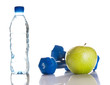 Dumbbells, green apple and a bottle of fresh water