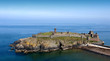 Ancient Castle on Island with Cliffs in the sea Ancient Castle on Island with Cliffs in the sea