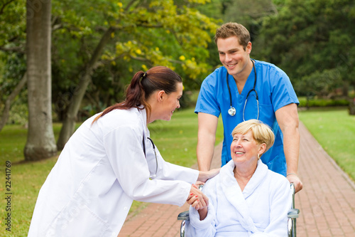 Photo: patient thanking young doctor patient thanking young doctor