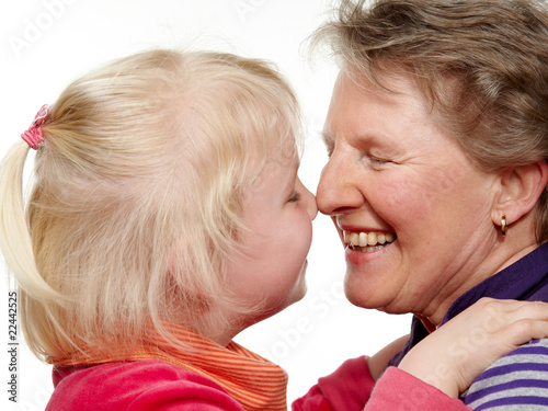 Foto: Granddaughter and grandmother touching their nose Granddaughter and grandmother touching their nose