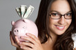 Woman Holding Piggy Bank