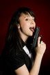 Prettty woman licking a gun