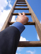 Businessman reaching for the next rung on the ladder Businessman reaching for the next rung on the ladder