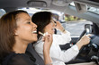 Women friends in car.