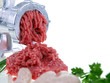 fresh ground meat, grinder & sausages on white background