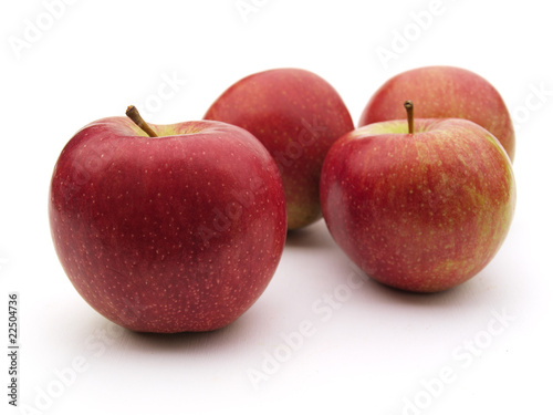 Photo: Some apples on a white table Some apples on a white table