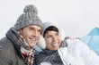 Young couple in winter clothes embracing