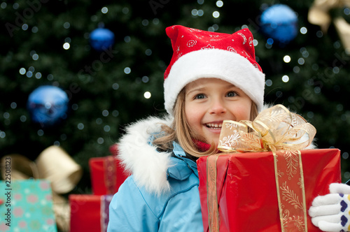Photo: Happy little girl at Christmas time Happy little girl at Christmas time
