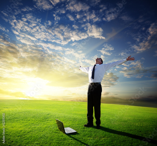Photo: happy young businessman and sunset happy young businessman and sunset