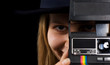 Attractive woman photographer taking picture. Retro camera Attractive woman photographer taking picture. Retro camera