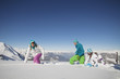 Couple and daughter walking in snow