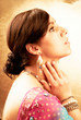 Beautiful indian brunette woman with traditional costume