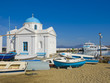 Church on Mykonos by the sea, surrounded by boats