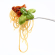 Spaghetti bolognese with basil leaves on a fork Spaghetti bolognese with basil leaves on a fork