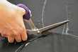 Dressmaker cutting fabric Dressmaker cutting fabric