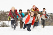 Photo: Group Of Teenage Friends Having Fun In Snowy Landscape Group Of Teenage Friends Having Fun In Snowy Landscape