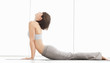The Cobra pose - Young woman practicing yoga