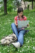 adventurous girl reading a city map