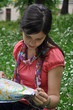 adventurous girl reading a map