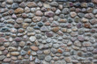 Wall of many-colored cobblestones