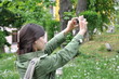 beautiful girl taking a photo in nature beautiful girl taking a photo in nature