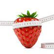 red strawberry on white background with meter