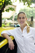 portrait of a female taxi driver with her new cab