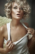 Vogue style portrait of a young blond beauty