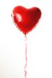 Foto: Red heart ballon with red and white strings on white fond Red heart ballon with red and white strings on white fond