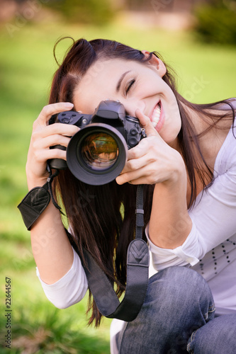 Foto: Beautiful girl with camera Beautiful girl with camera