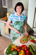 Woman cutting vegetables in the kitchen.