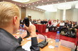conference in hall. man with microphone. focus on hand