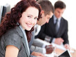 Confident buinesswoman smiling at the camera in a meeting