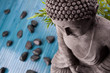 Buddha mit Bambus und Massage Steinen