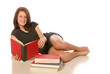 Teen girl studying in a text book on an isolated background
