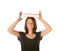 Teen girl balancing text book on her head