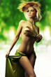 Young blond lady in a seductive pose