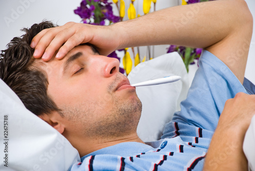 Photo: Close up of man with flu Close up of man with flu