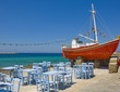The famous red boat and a tavern on the island of Mykonos
