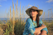 a portrait of a woman relaxing on a sunset beach a portrait of a woman relaxing on a sunset beach