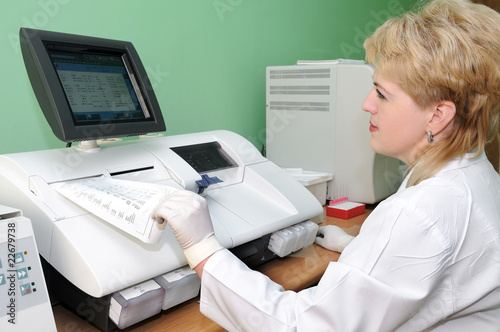 Photo: woman Scientist using medical equipment woman Scientist using medical equipment