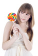 Bright picture of hungry blonde with color lollipop