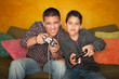 Hispanic Man and Boy Playing Video game