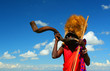 Masai warrior playing traditional horn