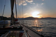 Sailing boat in the sea at sunset Sailing boat in the sea at sunset
