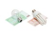 Energy save lamp versus bulb on euro bills isolated Energy save lamp versus bulb on euro bills isolated