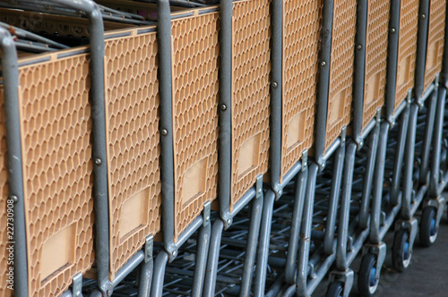 Photo: Retail image of a row of supermarket carts Retail image of a row of supermarket carts